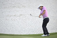 Sung Kang, of South Korea, chips onto the 18th green during the third round of the Arnold Palmer Invitational golf tournament, Saturday, March 7, 2020, in Orlando, Fla. (AP Photo/Phelan M. Ebenhack)