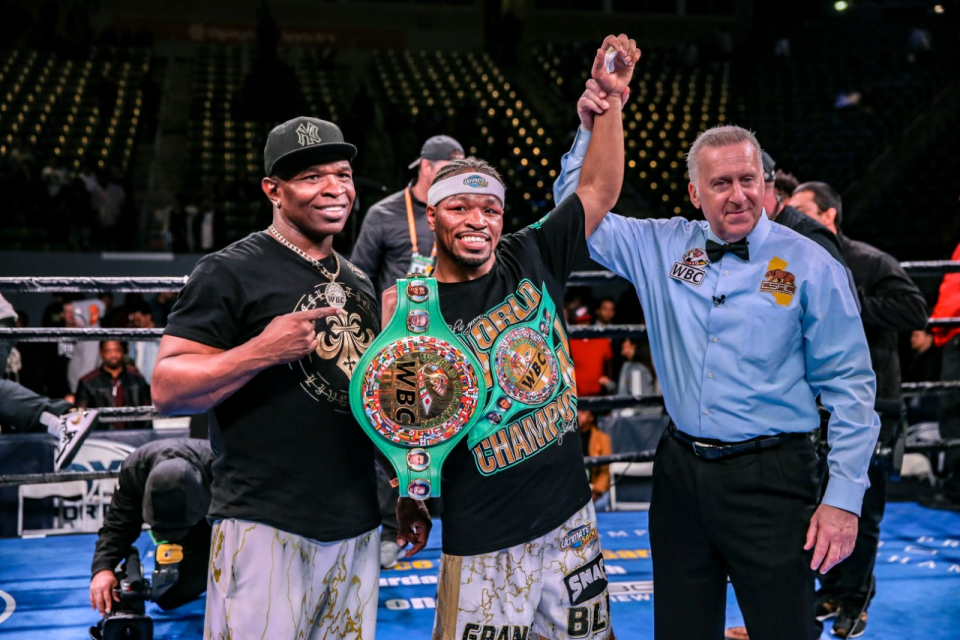 Kenny, left, and Shawn Porter celebrate a WBC welterweight title.