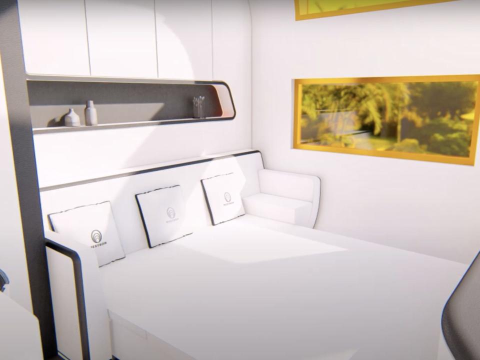 a rendering of the interior of the Cube Two X with a couch turned into a bed