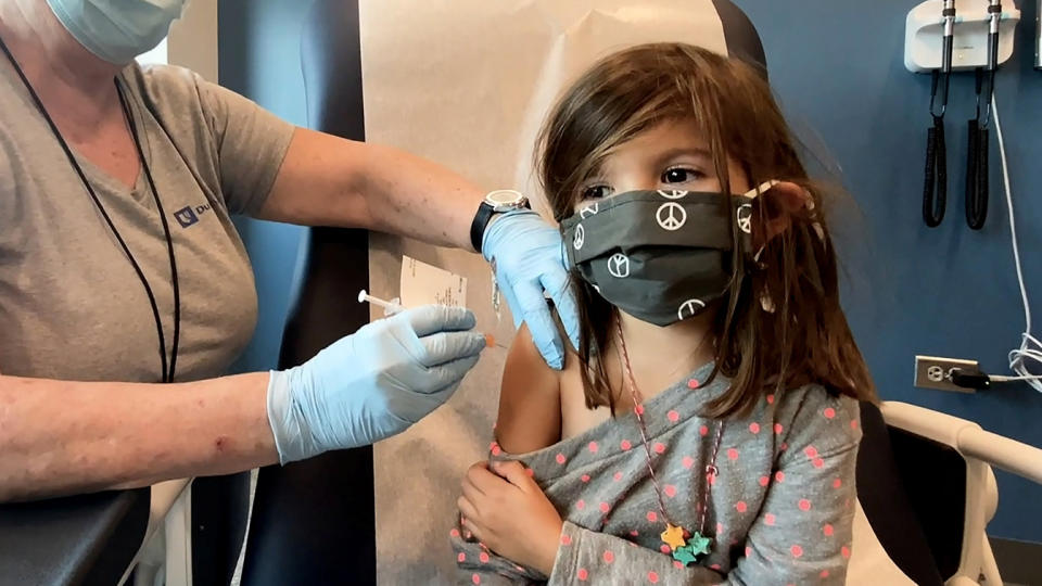 Bridgette Melo, 5, prepares for her inoculation of one of two reduced 10 ug doses of the Pfizer BioNtech COVID-19 vaccine during a trial at Duke University in Durham, North Carolina September 28, 2021 in a still image from video on September 28, 2021. (Shawn Rocco/Duke University/Handout via Reuters)