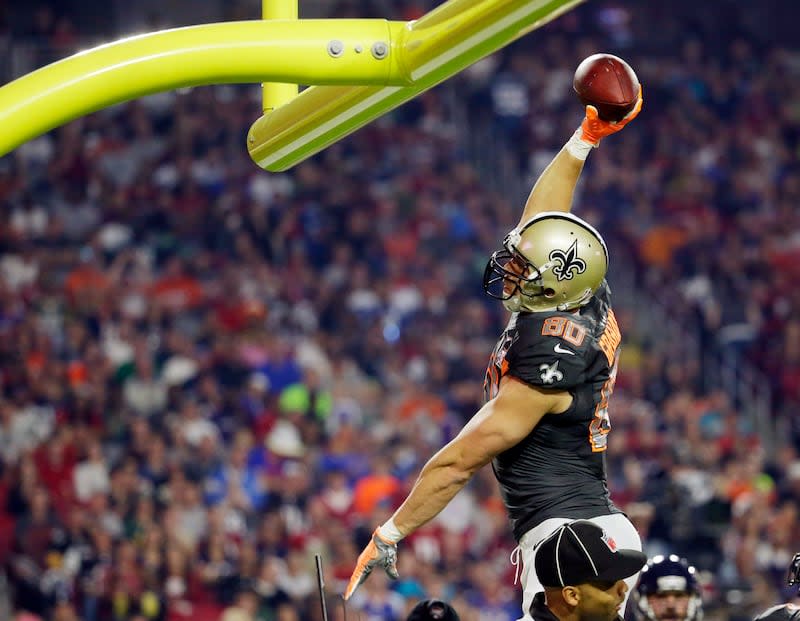 New Orleans Saints' Jimmy Graham leaps to dunkthe ball over the goal post after scoring a touchdown in the Pro Bowl Sunday, Jan. 25, 2015, in Glendale, Ariz. | Charlie Riedel