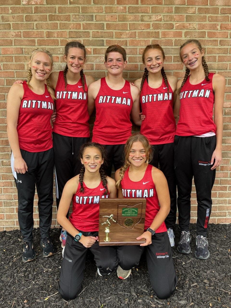 Rittman's girls cross country team, pictured here after their district title win, finished runner-up at the state meet despite most of the team consisting of freshmen and sophomores.