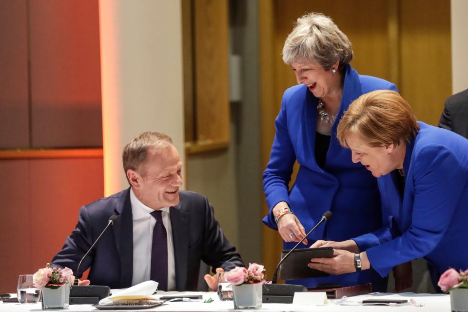 European Council president Donald Tusk (l) Britain’s prime minister Theresa May (c) and Germany’s chancellor Angela Merkel at the European Parliament in Brussels. Photo: Oliver Hoslet/AFP/Getty