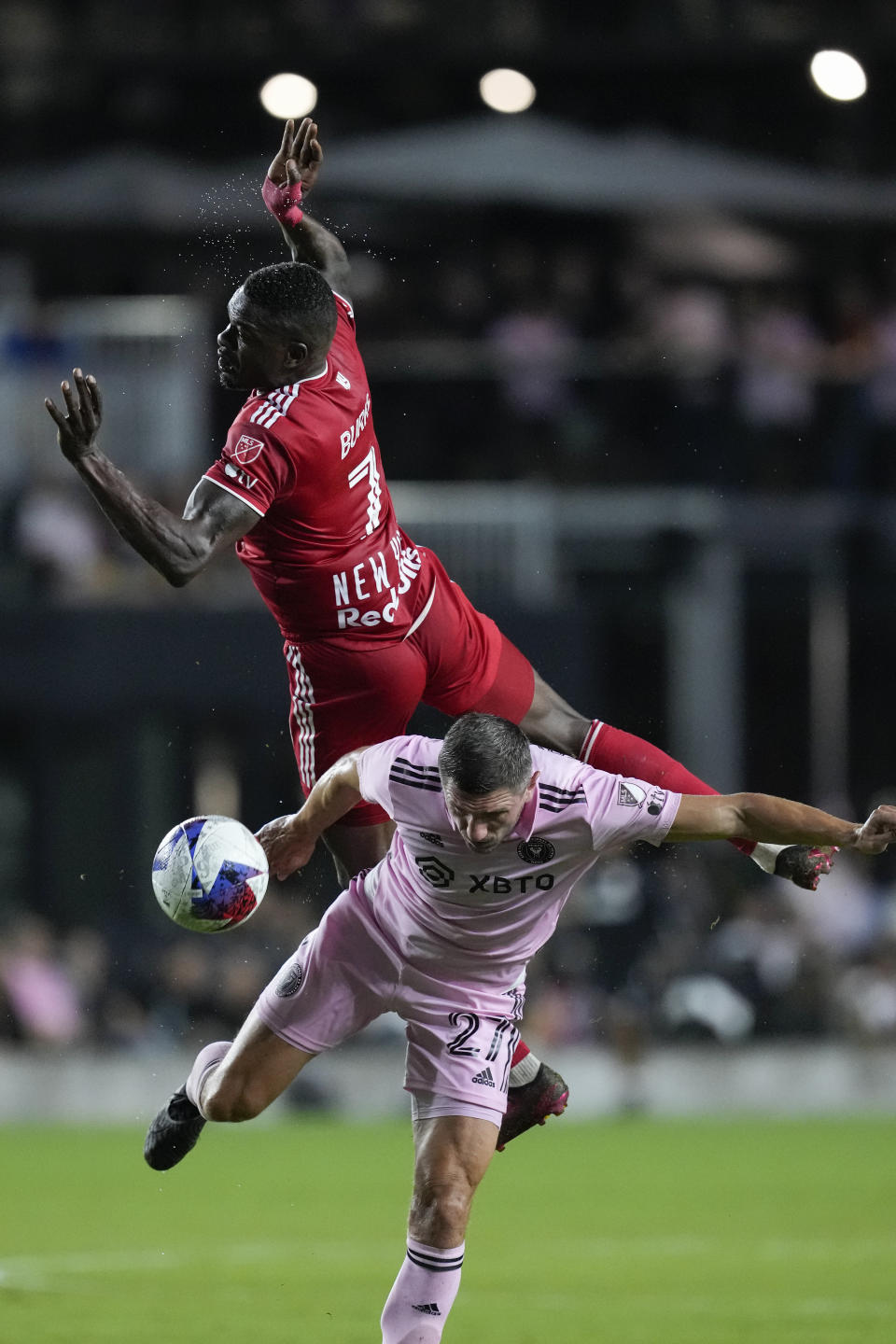 New York Red Bulls forward Cory Burke (7) vies for the ball with Inter Miami defender Serhiy Kryvtsov (27) during the first half of an MLS soccer match Wednesday, May 31, 2023, in Fort Lauderdale, Fla. (AP Photo/Rebecca Blackwell)