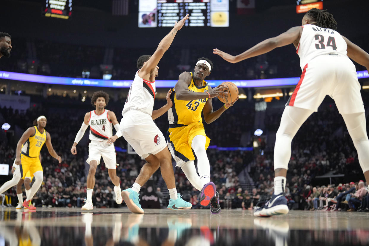 Jan 19, 2024; Portland, Oregon, USA; Indiana Pacers power forward Pascal Siakam (43) drives to the basket against Portland Trail Blazers point guard Malcolm Brogdon (11) during the first half at Moda Center. Mandatory Credit: Soobum Im-USA TODAY Sports