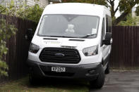 In this Sunday, March 29, 2020, photo, a teddy bear sits in the window of a van outside a house in Christchurch, New Zealand. New Zealanders are embracing an international movement in which people are placing teddy bears in their windows during coronavirus lockdowns to brighten the mood and give children a game to play by spotting the bears in their neighborhoods. (AP Photo/Mark Baker)