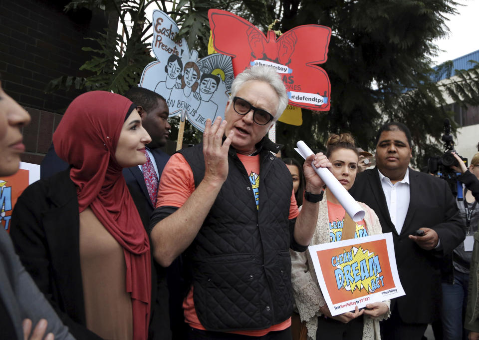 <p>Actor Bradley Whitford speaks to demonstrators, urging the Democrats to protect the Deferred Action for Childhood Arrivals (DACA) program, during a rally outside the office of California Democratic Sen. Dianne Feinstein in Los Angeles, Jan. 3, 2018. (Photo: Reed Saxon/AP) </p>