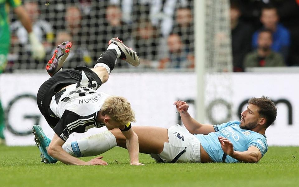 Newcastle, Britain - September 28, 2024 Manchester City's Ruben Dias fouls Newcastle United's Anthony Gordon