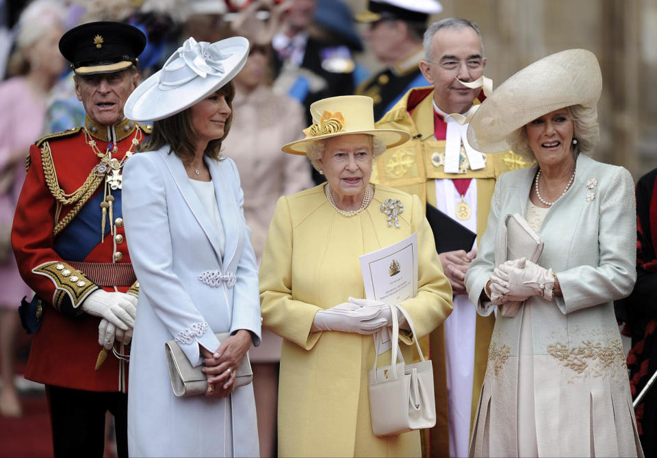 Prince Phillip, Carole Middleton, Queen Elizabeth II and Camilla, Duchess of Cornwall stand outside of Westminster Abbey after the Royal Wedding of Prince William and Kate Middleton in London. (Martin Meissner / AP)