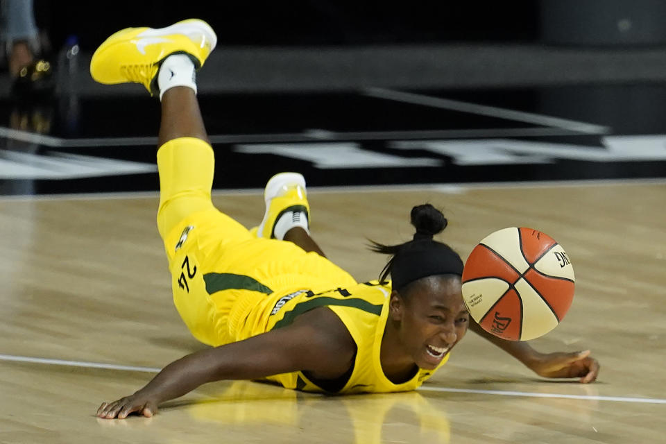 Seattle Storm guard Jewell Loyd (24) dives for a loose ball during the second half of Game 1 of a WNBA basketball semifinal round playoff series against the Minnesota Lynx Tuesday, Sept. 22, 2020, in Bradenton, Fla. (AP Photo/Chris O'Meara)