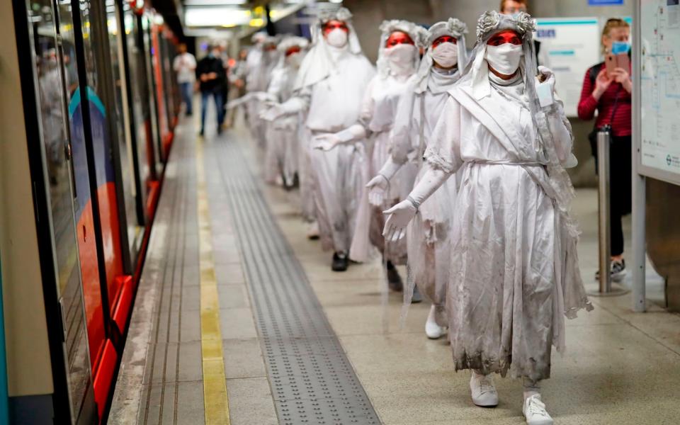 An XR protest at the Docklands Light Railway last month  - AFP