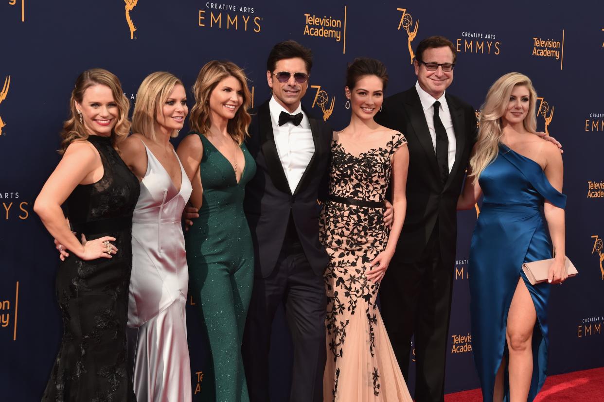 (L-R) Actors Andrea Barber, Candace Cameron Bure, Lori Loughlin, John Stamos, Caitlin McHugh, Bob Saget and Kelly Rizzo attend the 2018 Creative Arts Emmy Awards at Microsoft Theater on Sept. 8, 2018, in Los Angeles, Calif.
