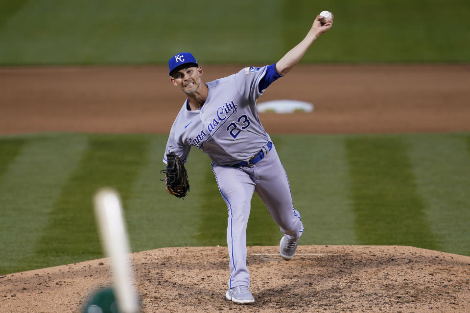 Kansas City Royals' Mike Minor pitches against the Oakland Athletics during the sixth inning of a baseball game in Oakland, Calif., Thursday, June 10, 2021. (AP Photo/Jeff Chiu)