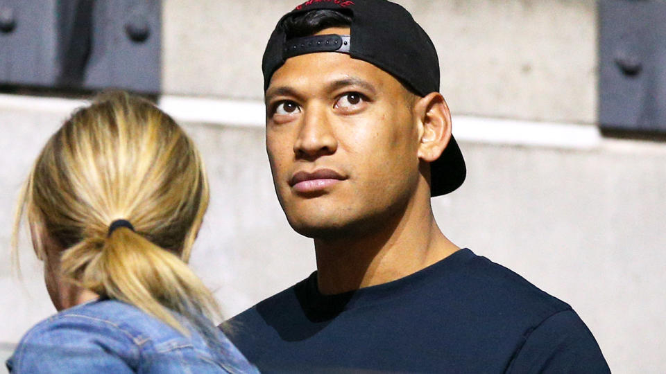 Israel Folau, pictured here watching his wife at the Netball World Cup.