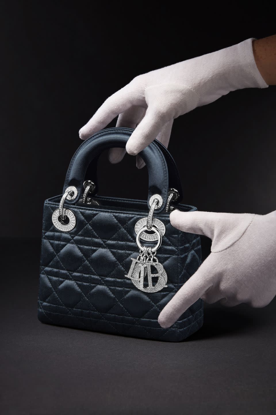 The contemporary Lady Dior Bag in blue sattin.