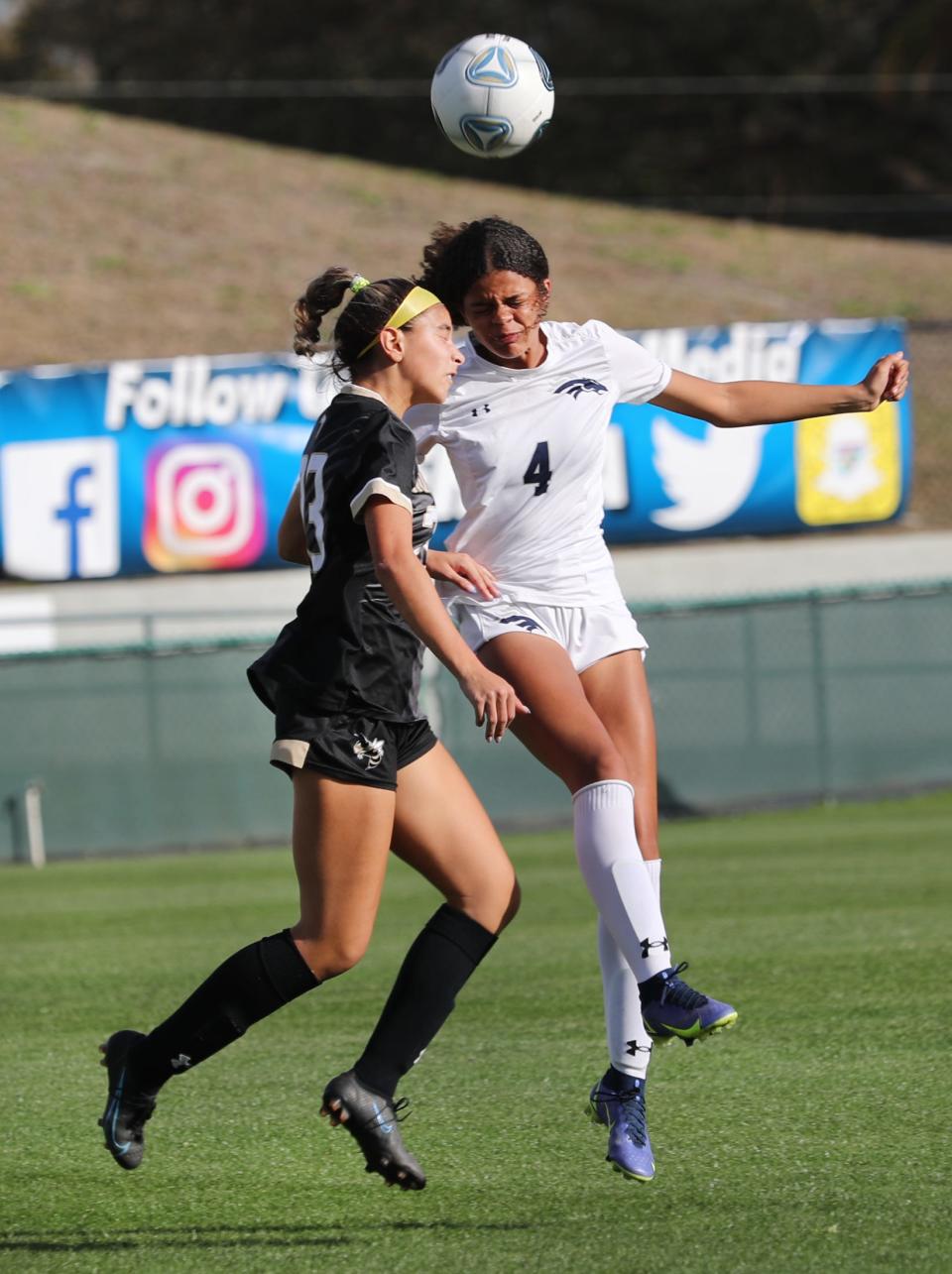 American Heritage's Kayla Harrell (4) goes for a header against Bishop Moore in the State 4A Soccer championships, Friday Feb. 23, 2022 in DeLand.