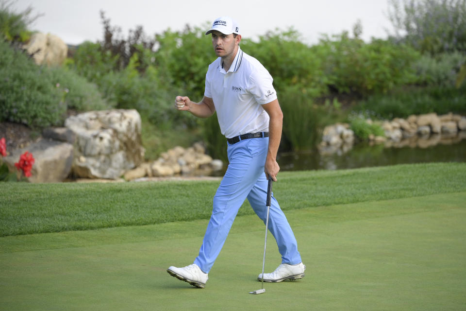 Patrick Cantlay reacts after sinking his putt on the 128th green during the final round of the BMW Championship golf tournament, Sunday, Aug. 29, 2021, at Caves Valley Golf Club in Owings Mills, Md. (AP Photo/Nick Wass)