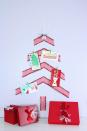 <p>Pieces of sparkly ribbon and tiny clothespins team up to create an alternative Christmas tree, perfect for displaying heartwarming cards. </p><p><strong>Get the tutorial at <a href="https://thecelebrationshoppe.com/easy-diy-christmas-card-holder-ribbon-tree/" rel="nofollow noopener" target="_blank" data-ylk="slk:The Celebration Shoppe;elm:context_link;itc:0;sec:content-canvas" class="link ">The Celebration Shoppe</a>.</strong></p><p><a class="link " href="https://www.amazon.com/Wide-Tinsel-Solid-Silver-Yards/dp/B074NWSLXP/ref=sr_1_11?tag=syn-yahoo-20&ascsubtag=%5Bartid%7C10050.g.28872053%5Bsrc%7Cyahoo-us" rel="nofollow noopener" target="_blank" data-ylk="slk:SHOP TINSEL RIBBON;elm:context_link;itc:0;sec:content-canvas">SHOP TINSEL RIBBON</a></p>