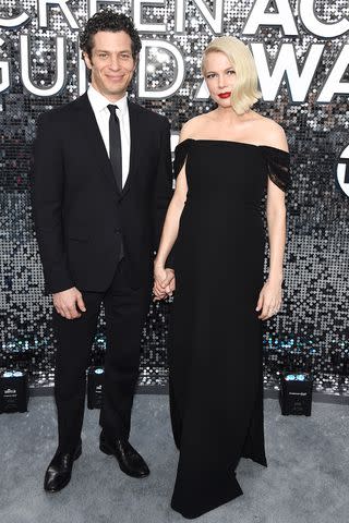 John Shearer/Getty Thomas Kail and Michelle Williams