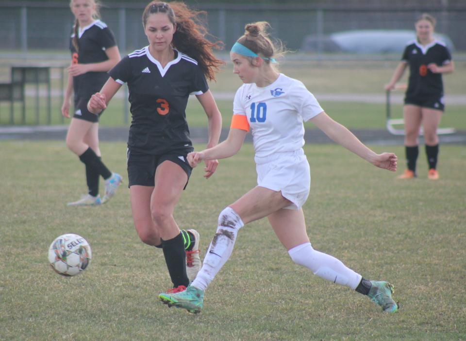 Cheboygan senior Kenzie Burt (left) and Gladwin senior Anna Seebeck (10) battle for the ball during the second half of a girls soccer matchup in Cheboygan on Friday.
