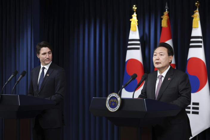 South Korea's President Yoon Suk Yeol, right, speaks as Canada's Prime Minister Justin Trudeau, left, looks on during a joint press conference after their meeting at the Presidential Office in Seoul, South Korea, Wednesday, May 17, 2023. (Kim Hong-Ji/Pool Photo via AP)