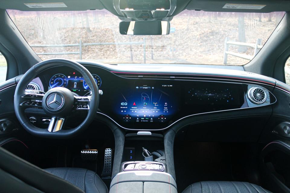 The 2023 Mercedes-Benz EQS SUV's steering wheel and large Hyperscreen display.