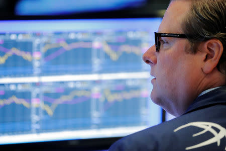 A trader works on the floor of the New York Stock Exchange shortly after the opening bell in New York, U.S., July 31, 2018. REUTERS/Lucas Jackson