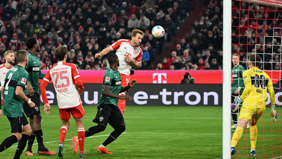 Kane scored a header in the second half to become the quickest player to reach 20 Bundesliga goals. - Angelika Warmuth/Reuters