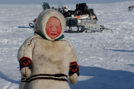 A child from the indigenous community "Yamb To" (Long Lake) is seen at a reindeer camping ground, about 450 km northeast of Naryan-Mar, in Nenets Autonomous District, Russia, March 1, 2018. REUTERS/Sergei Karpukhin