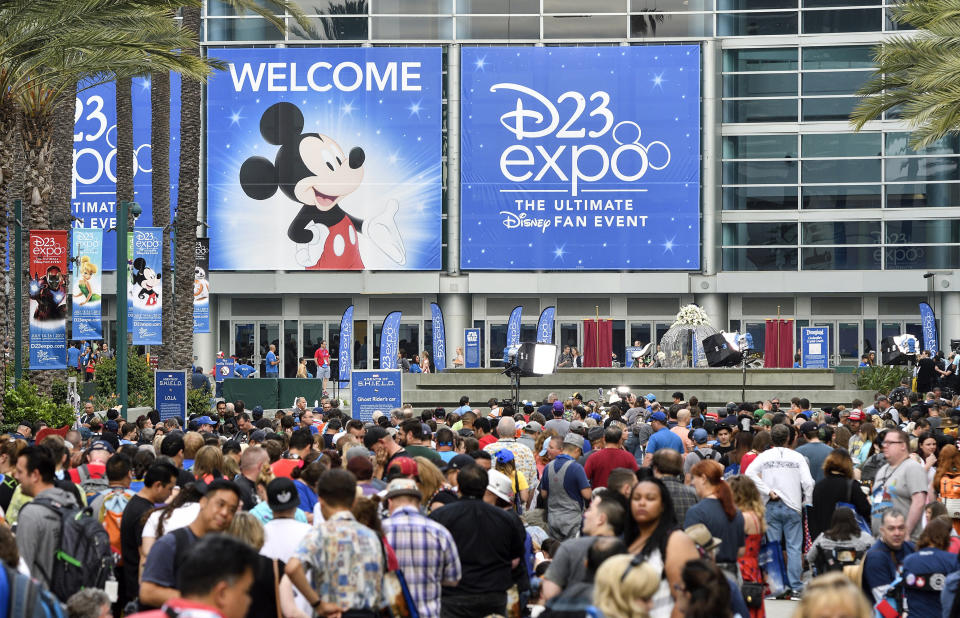 FILE - In this July 14, 2017, file photo a crowd of people wait to enter the D23 Expo as crews do interviews outside the Anaheim Convention Center in Anaheim, Calif. Members of Disney’s free D23 fan club were eligible to buy three years of Disney Plus service up front for the price of two years. (Jeff Gritchen/The Orange County Register via AP, File)