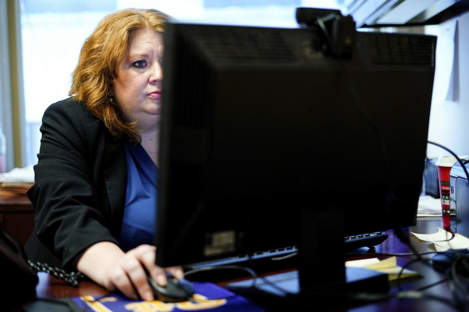 Attorney Robin Frank works in her office in Pittsburgh, Thursday, March 17, 2022. A longtime family law attorney, Frank fights for parents at one of their lowest points – when they risk losing their children. (AP Photo/Matt Rourke)