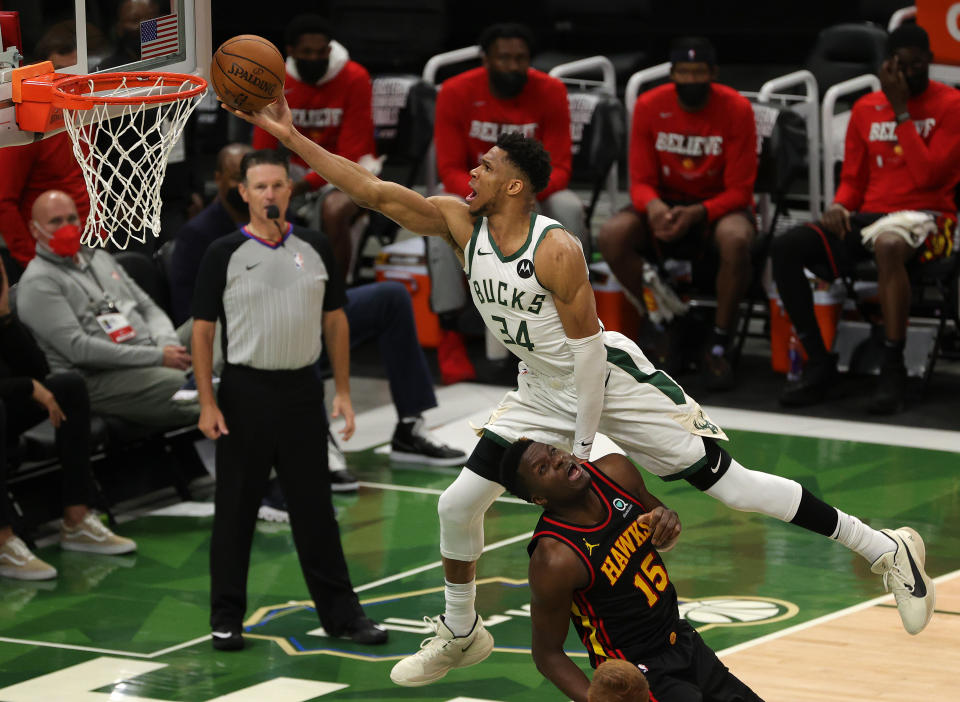 MILWAUKEE, WISCONSIN - JUNE 25: Giannis Antetokounmpo #34 of the Milwaukee Bucks goes up for a shot against Clint Capela #15 of the Atlanta Hawks during the second half in game two of the Eastern Conference Finals at Fiserv Forum on June 25, 2021 in Milwaukee, Wisconsin. NOTE TO USER: User expressly acknowledges and agrees that, by downloading and or using this photograph, User is consenting to the terms and conditions of the Getty Images License Agreement. (Photo by Stacy Revere/Getty Images)