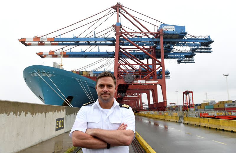 Captain Jens Boysen gives an interview in front of the Maersk Line container ship "Emma Maersk" during the spread of the coronavirus disease (COVID-19) in the harbour in Hamburg