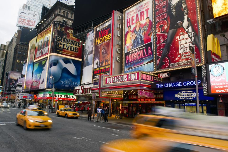 FILE - This Jan. 19, 2012 file photo shows billboards advertising Broadway shows in Times Square, in New York. Superstorm Sandy, which darkened Broadway while smashing into New York City last week, predictably ravaged the box offices around Times Square, with shows losing more than $6 million from the previous week. (AP Photo/Charles Sykes, file)