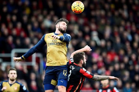 Football Soccer - AFC Bournemouth v Arsenal - Barclays Premier League - Vitality Stadium - 7/2/16 Arsenal's Olivier Giroud in action with Bournemouth's Steve Cook Reuters / Dylan Martinez Livepic