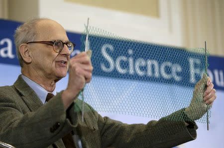 Dr. Rainer Weiss, emeritus professor of physics at MIT, uses a visual aide during a news conference to discuss the detection of gravitational waves, ripples in space and time hypothesized by physicist Albert Einstein a century ago, in Washington February 11, 2016. REUTERS/Gary Cameron