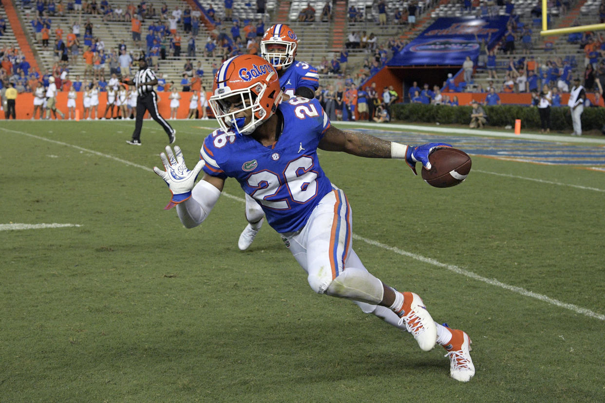 Florida defensive back John Huggins (26) celebrates after intercepting a pass during the second half of an NCAA college football game against Charleston Southern Saturday, Sept. 1, 2018, in Gainesville, Fla. Florida won 53-6. (AP Photo/Phelan M. Ebenhack)