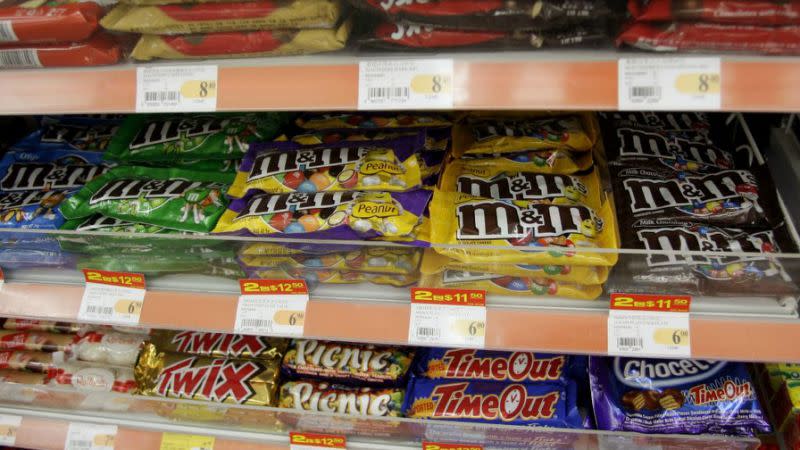 Chocolate bars are seen on a store shelf. (Quartz)