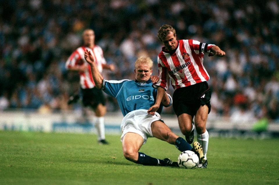 Manchester City's Alf Inge Haaland (l) tackles Sunderland captain Michael Gray (r)  (Photo by Matthew Ashton/EMPICS via Getty Images)