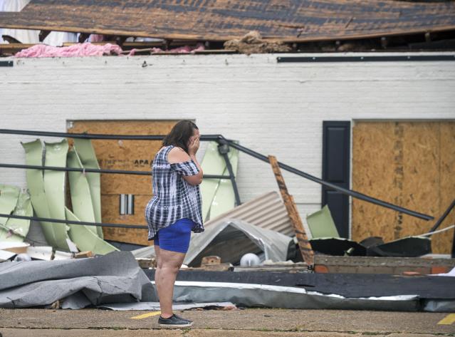 Business owners survey the damage of Hurricane Laura Friday, Aug. 28, 2020 in Lake Charles. Recovery efforts were underway after Hurricane Laura. (Chris Granger/The Times-Picayune/The New Orleans Advocate Via AP)