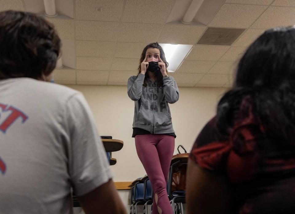 Nicole Perry (middle), intimacy coordinator, instructs actors Samuel Krogh (left) and Noelle Nicholas (right) to maintain eye contact while choreographing a first kiss scene in the play XOXOLOLA by Rachel Greene put on by LakehouseRanchDotPNG on Aug. 9, 2023, at Graham Center on FIU campus. The play ran from September 22 through October 1 this year. “I call them flavors,” Perry said. “I am always saying to the director like ‘What flavor is this kiss? What’s the story that we’re trying to tell here?’ And that’s what we do really with the bodies and the shapes and the time that we’re together with that choreography.” Lauren Witte/lwitte@miamiherald.com