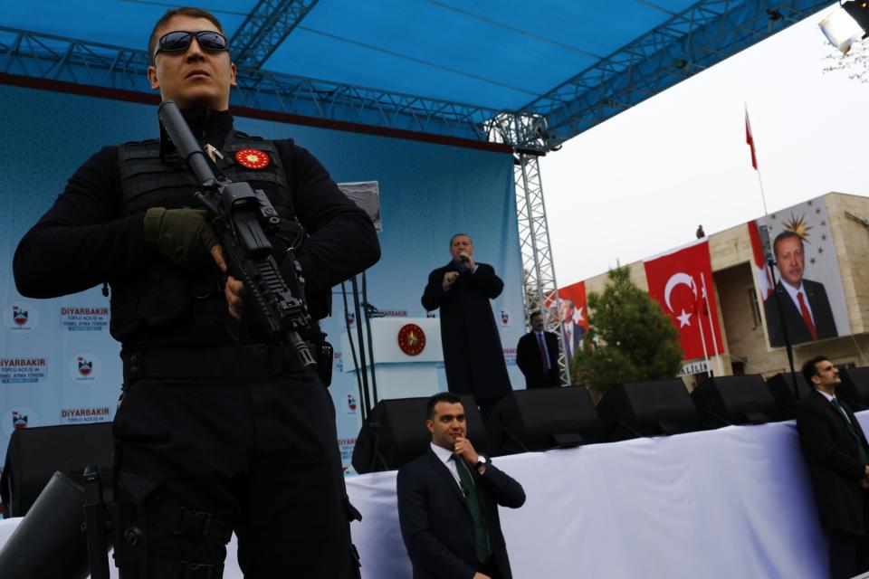 <p>Turkish President Tayyip Erdogan addresses his supporters as his guards secure the stage during a rally for the upcoming referendum in the Kurdish-dominated southeastern city of Diyarbakir, Turkey, April 1, 2017. (Murad Sezer/Reuters) </p>