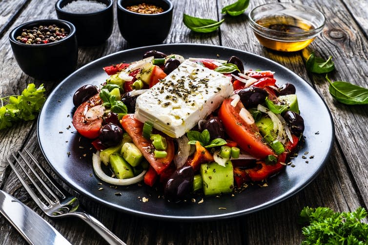 <span class="caption">Greek food today is not the same as the historic healthy diets, but still often includes fresh vegetables and olives.</span> <span class="attribution"><a class="link " href="https://www.shutterstock.com/image-photo/fresh-greek-salad-feta-cheese-tomatoes-1801238539" rel="nofollow noopener" target="_blank" data-ylk="slk:Jacek Chabraszewski/Shutterstock;elm:context_link;itc:0;sec:content-canvas">Jacek Chabraszewski/Shutterstock</a></span>