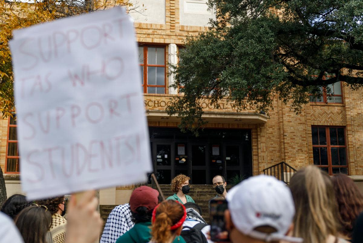 TAs Callie Kennedy, left, and Parham Daghighi, right, speak to a crowd. UT Austin students rallied at the Steve Hicks School of Social Work in a protest demanding the reinstatement of TAs Callie Kennedy and Parham Daghighi on Dec. 8, 2023.