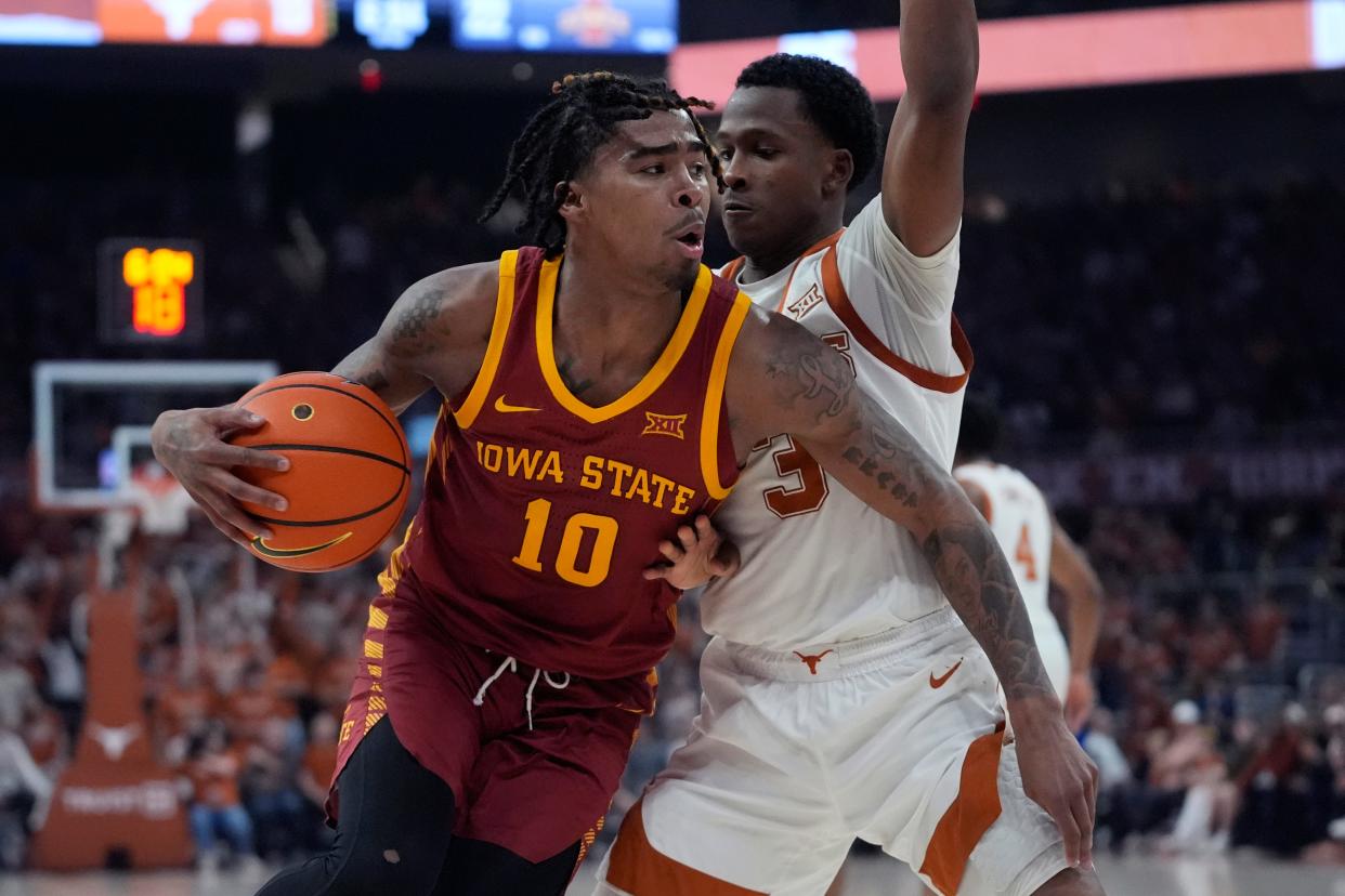 Iowa State guard Keshon Gilbert (10) is defended by Texas guard Max Abmas.