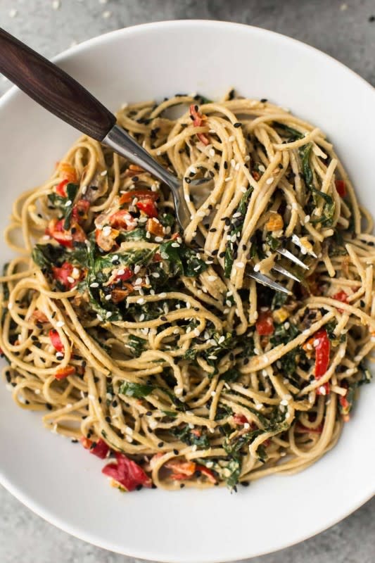 <p>A creamy vegan noodle bowl with wilted collards and a homemade tahini sauce. Perfect for a light dinner or work lunch.</p><p><strong>Get the recipe: <a href="https://naturallyella.com/tahini-noodle-bowl/" rel="nofollow noopener" target="_blank" data-ylk="slk:Tahini Soba Noodle Bowl with Collards;elm:context_link;itc:0;sec:content-canvas" class="link "><em>Tahini Soba Noodle Bowl with Collards</em></a></strong></p>
