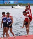 Gold medallists Mads Rasmussen and Rasmus Quist of Denmark (R) celebrate next to silver medallists Zac Purchase and Mark Hunter of Britain after competing in the men's lightweight double sculls final during the London 2012 Olympic Games at Eton Dorney August 4, 2012. REUTERS/Jim Young (BRITAIN - Tags: OLYMPICS SPORT ROWING) 