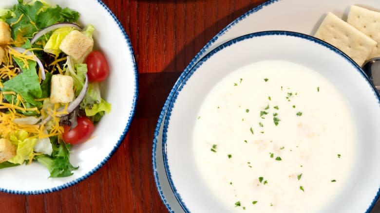 Bowl of New England clam chowder with crackers