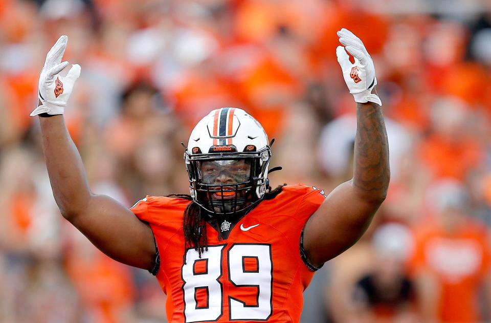 Oklahoma State defensive lineman Tyler Lacy had one of the Cowboys' two sacks in the season opener on Thursday.