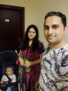 In this family photo, Kamran Arshad, his wife Iqra Kamran, and infant daughter Hiyam Kamran pose for a photograph in Dubai, United Arab Emirates, July 7, 2020. They are among the hundreds of thousands of foreign residents of the United Arab Emirates who now are stuck abroad amid the coronavirus pandemic. (Kamran Arshad via AP)